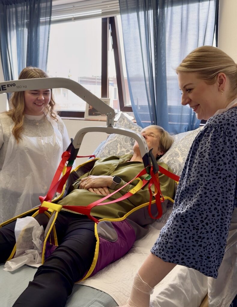 Anchusa Care colleagues learning how to use a hoist safely during training